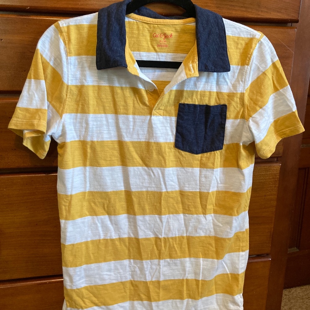 Yellow, white, and heathered navy boys’ polo shirt